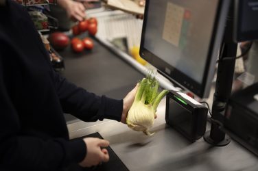 worker-scanning-vegetable-supermarket